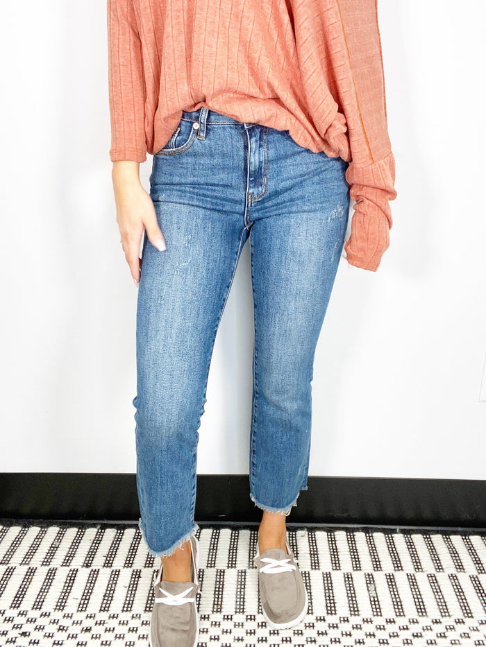 Risen Mid Rise Medium Wash Raw Hem Straight Jeans