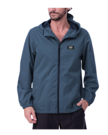 Male model wearing blue hooded windbreaker jacket with front zipper and small rectangular chest logo patch