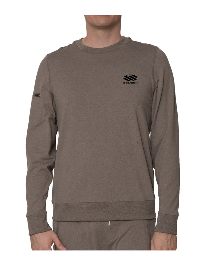 Men's brown crewneck sweatshirt with small 'SELKIRK' logo on left chest and zip pocket on left sleeve.