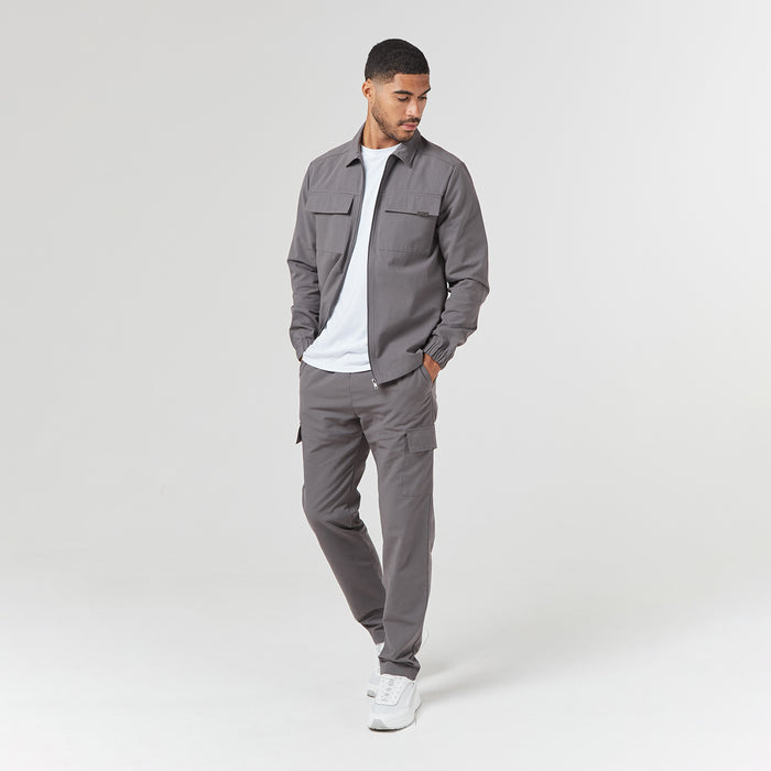 Model wearing open hem cargo pants in charcoal grey