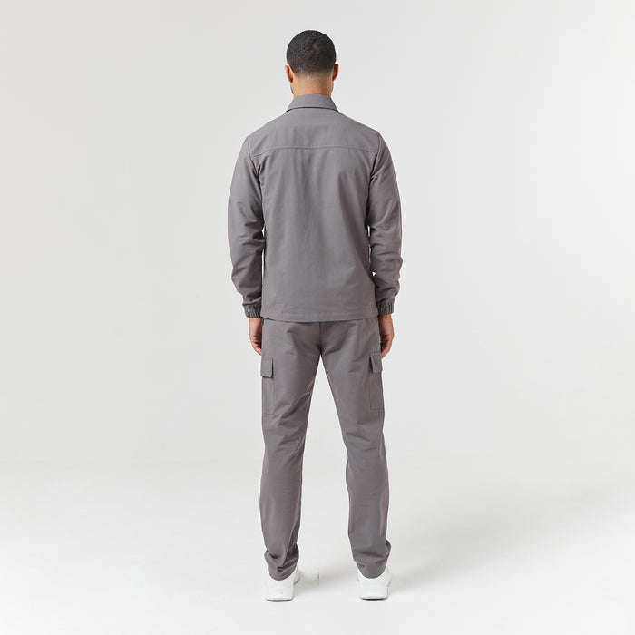 Back profile of mens cargo pants in charcoal grey