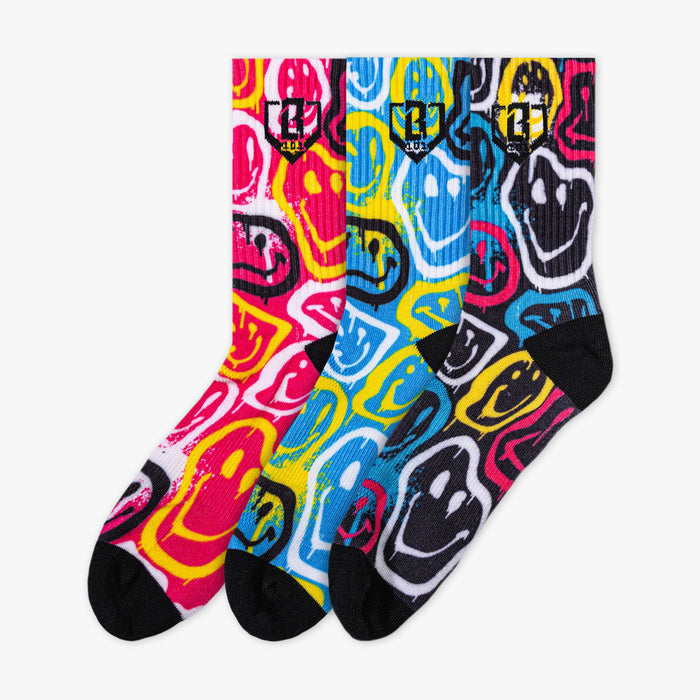 Adult model wearing multi-color socks with "Smiley Slugger Performance  3-Pack" design