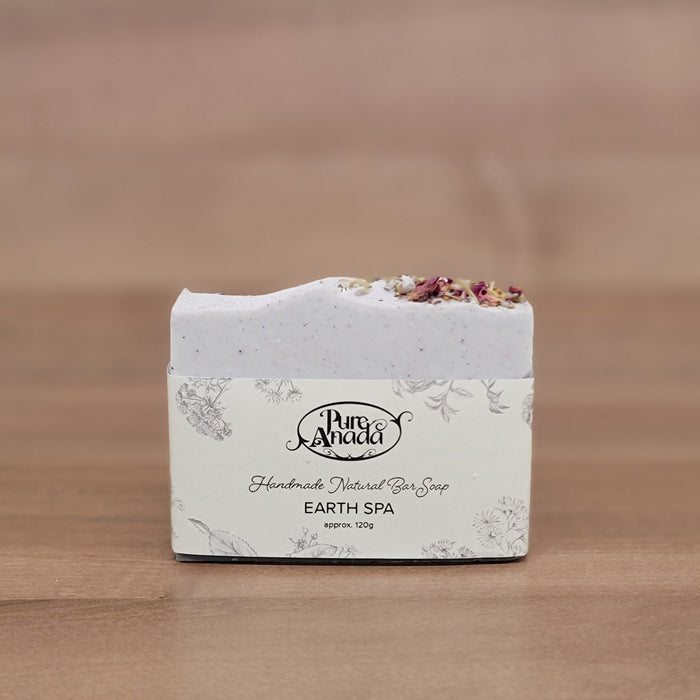 Earth day Pure Anada Soap bar with decorative packaging on a wooden surface