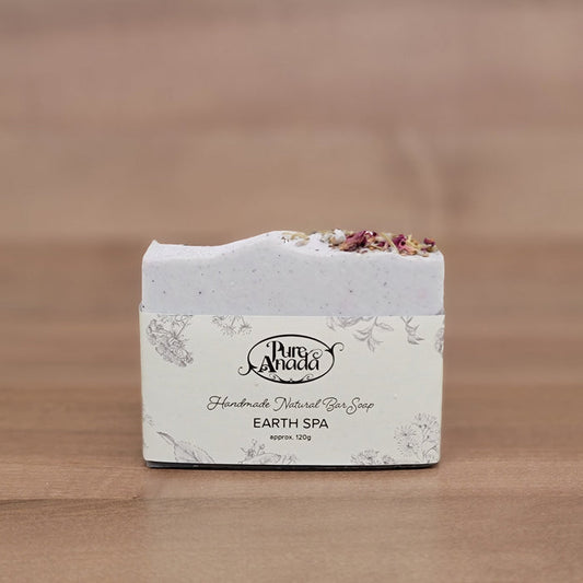Earth day Pure Anada Soap bar with decorative packaging on a wooden surface