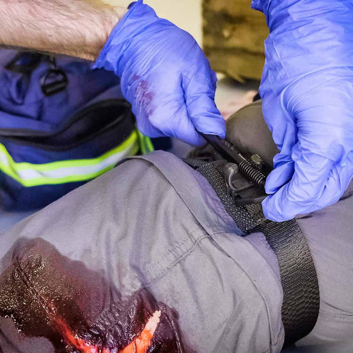 SOF Tourniquet - Generation 5 in use on leg by first responder