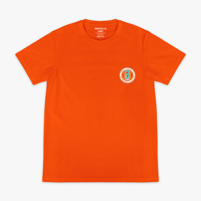 Orange t-shirt with a small BL101 logo on the chest against a white background