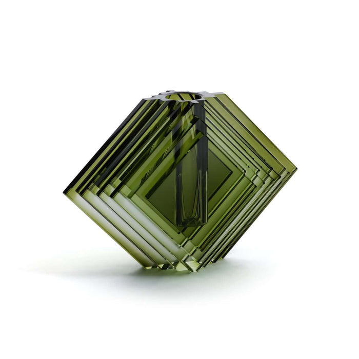 Hexagonal green crystal on a white background