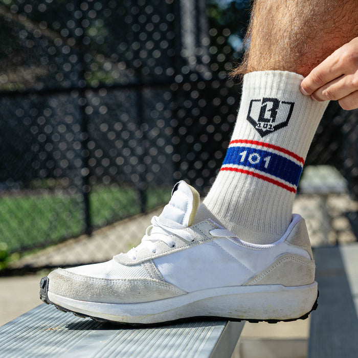 Adult model wearing red, white & blue socks with "Stadium Performance  3-Pack" design