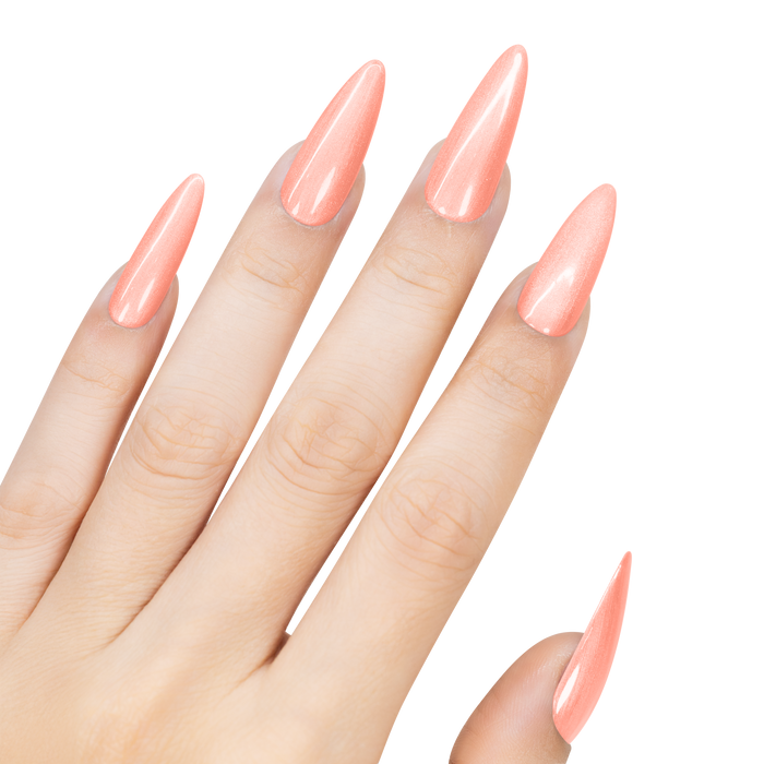 Hand with peach-colored nail polish on a white background