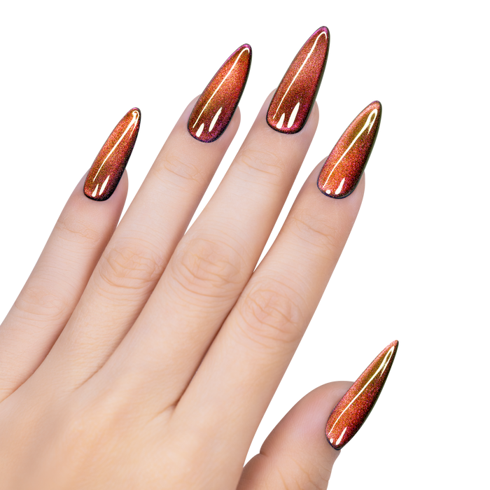 Hand with long, pointed nails featuring multicolored cat eye polish on a white background