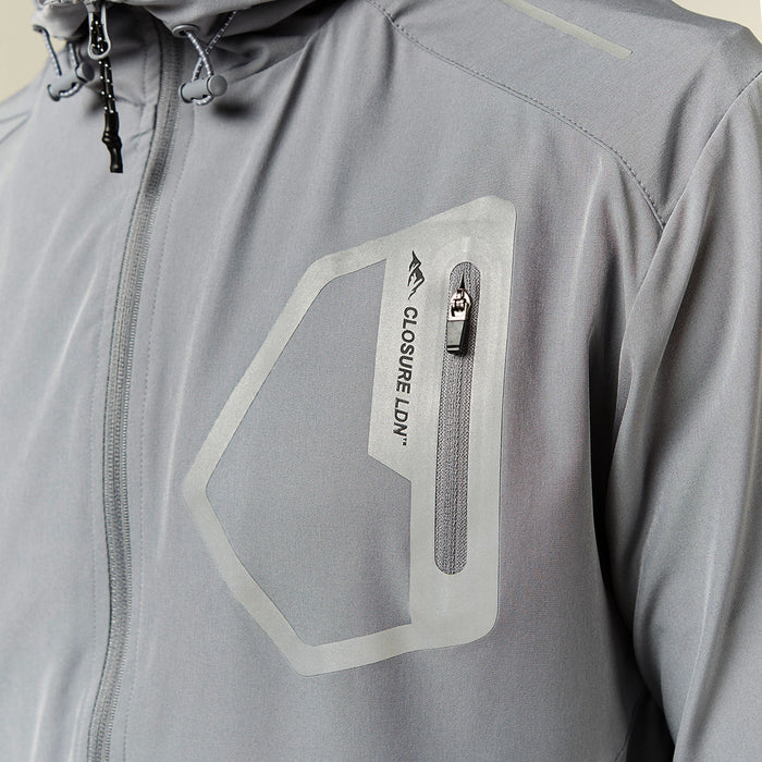 Close up on Closure London's technical jacket in grey with zip pocket