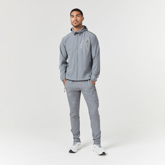 Full length shot of male model wearing technical tracksuit in grey