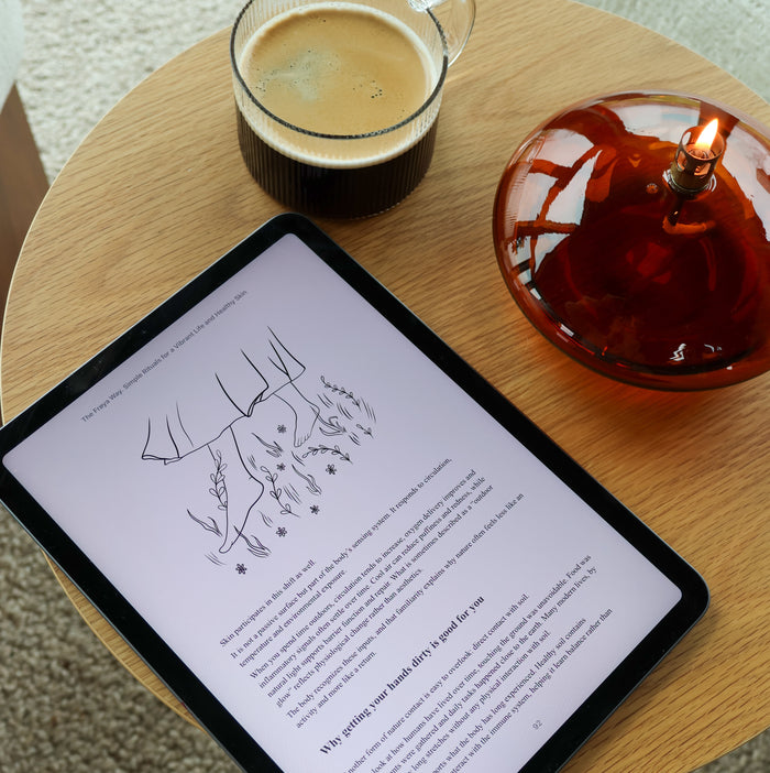 'The Frøya Way' on an e-reader beside a cup of tea