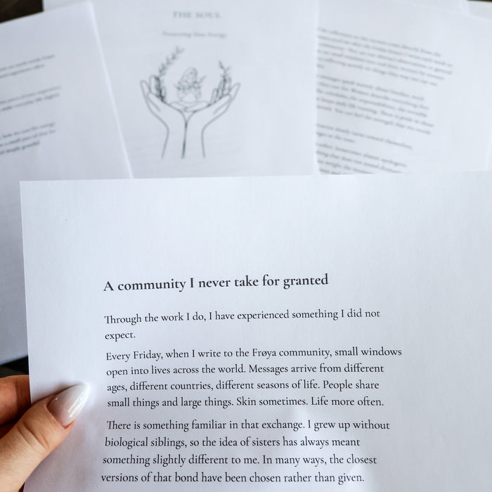 Open pages of 'The Frøya Way' with the essay 'A community I never saw for granted'