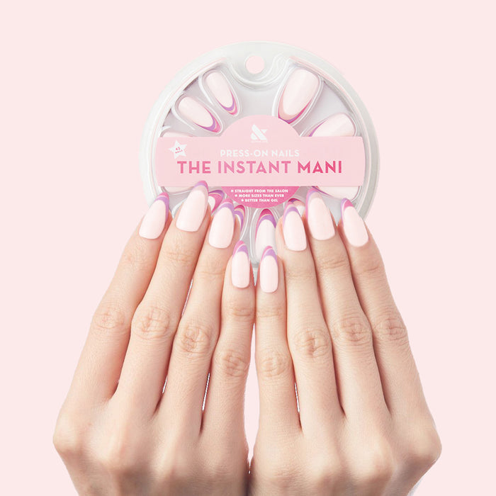 Twisted French - Press-On | Long | Almond showing long almond press-on nails with pink and white French twist manicure