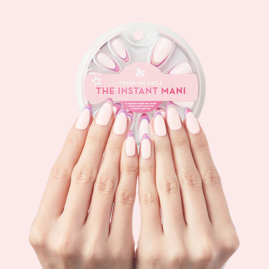 Twisted French - Press-On | Long | Almond showing long almond press-on nails with pink and white French twist manicure