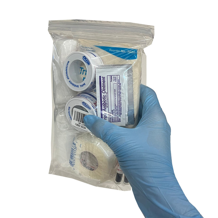 Universal First Aid Refill Kit, in hand - back