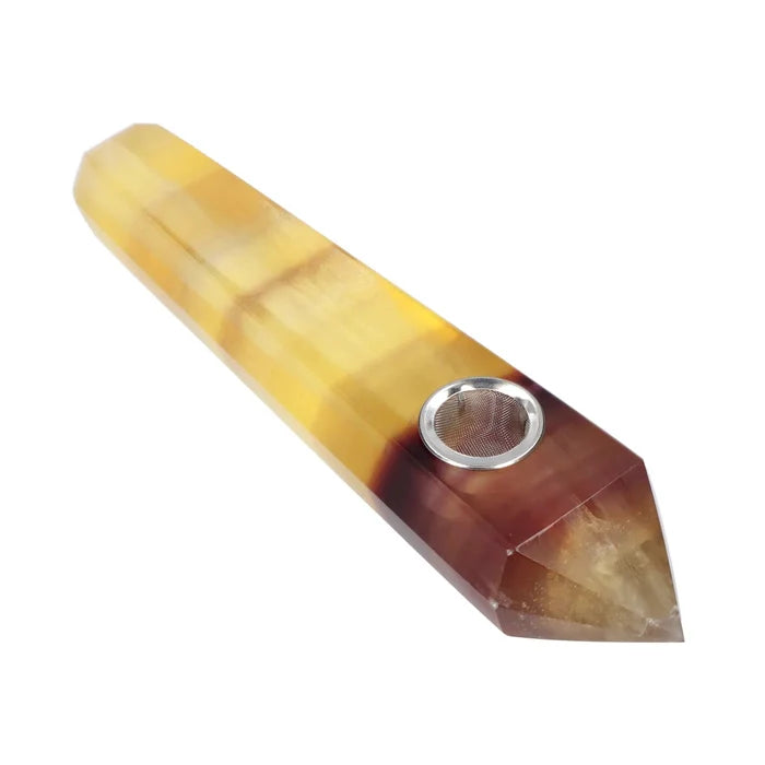 A close-up, angled view of the Valiant Crystal Pipe - Wood Grain, showcasing its textured, amber-colored glass body.