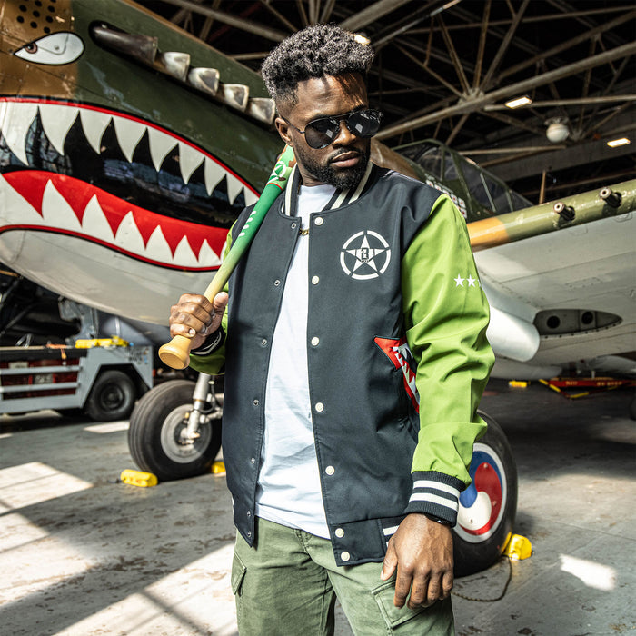 Adult model wearing black and army green Warhawk Bomber Jacket jacket