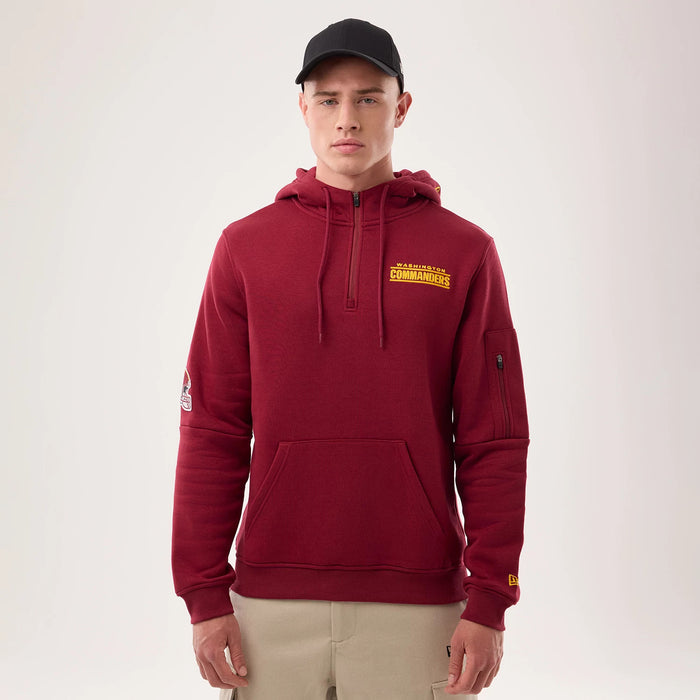 The model is wearing this NFL Sideline 2026 Washington Commanders Pullover Hoodie in dark red. 1