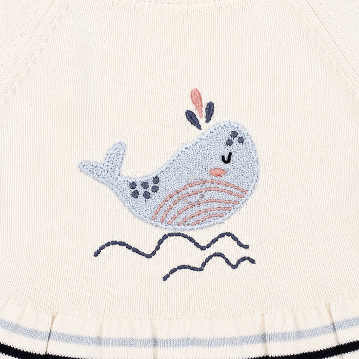 detail shot of Whale Embroidered Ruffle Baby Short Dress made with organic cotton