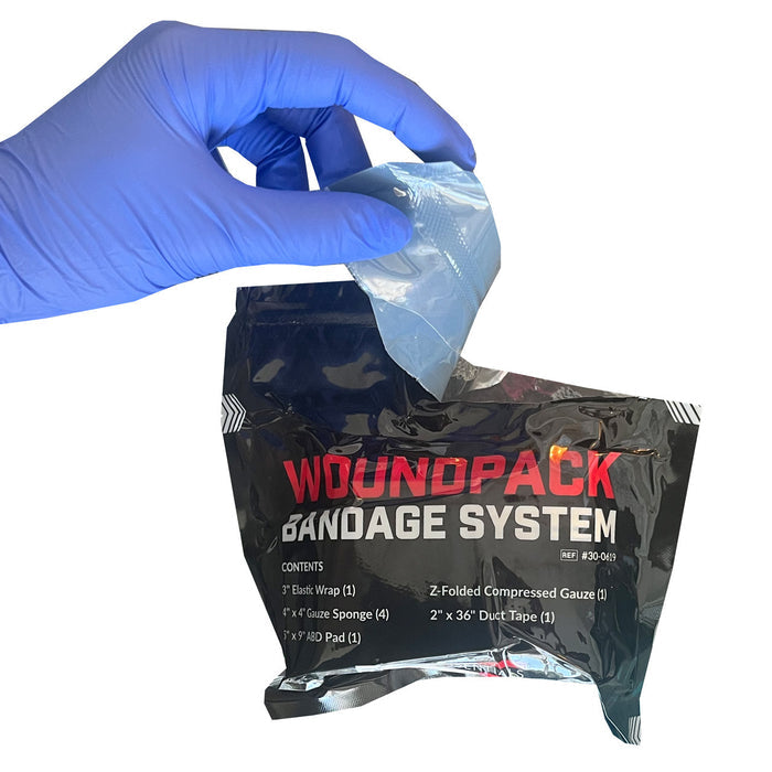 Rescue Essentials WoundPack Bandage System, being opened